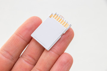 White sd card in hand
