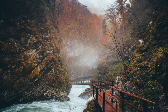 Vintgar gorge and wooden path in autumn rainy day. Bled, Slovenia