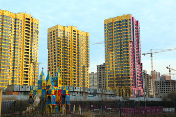 Large residential apartment building with a coloured façade.Modern residential urban architecture.