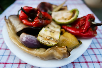 Grilled vegetables on a white plate. Vegetable mix.