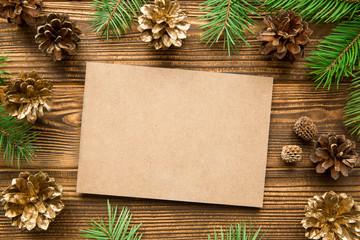 FIr tree branches with golden cones. Christmas mood, copy space. Space for text.