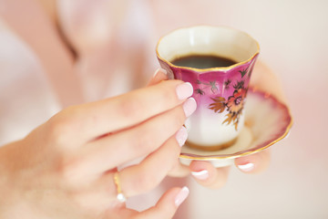 The girl is drinking coffee. Morning Bride Fees