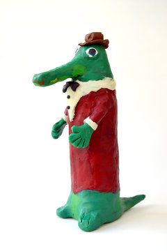 Plasticine figure Gena's Crocodile on a white background. Children's creativity