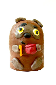 Plasticine figure Winnie-the-Pooh on a white background. Children's creativity