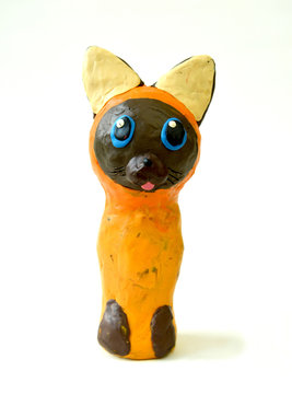 Plasticine figure of Kotenok Gav on a white background. Children's creativity