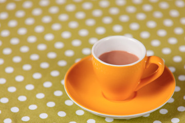 yellow a cup of coffee on polka dot cover