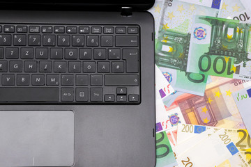Euro Bills and Laptop