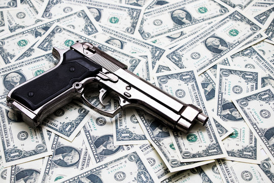 Gun on one Dollar Bills