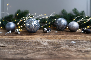 Elegant gray christmas scene on natural wood background with copy space, shallow focus
