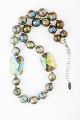 silver beads labradorite stone white background 
