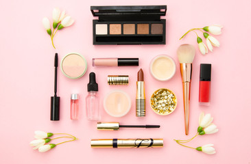 Professional decorative cosmetics, make-up tools and accessory on pink background. Beauty, fashion and shopping concept. flat lay composition, top view. Mockup for beauty blog