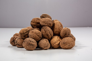pile of walnuts on white background