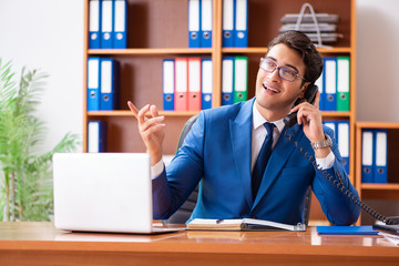 Young employee working in the office