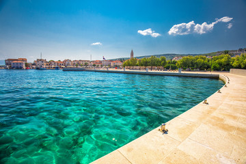 Seaside promenade in Supetar town on Brac island with palm trees and turquoise clear ocean water, Supetar, Brac, Croatia, Europe