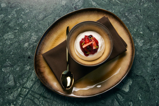 Ice cream with fresh strawberries, marshmallow, currants and min