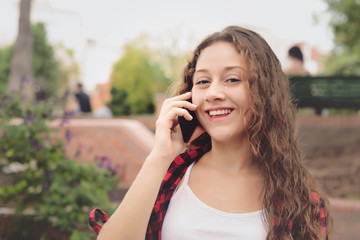 Young woman talking on her mobile phone.