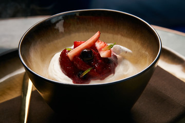 Ice cream with fresh strawberries, marshmallow, currants and min