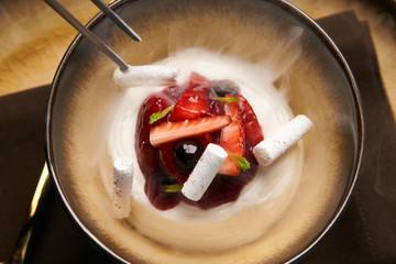 Cook chef making fruit ice cream added liquid nitrogen