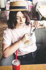 01.09.2018 - Yerevan,Armenia: Young casual dressed woman with coca cola bottle