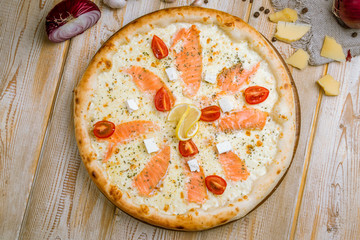 Pizza with salmon and Philadelphia cheese