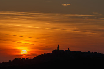 Sillhouette of the city at sunset, Italy. Travel Europe.