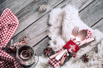 Fototapeta premium Christmas dinner cutlery with decor on a wooden background