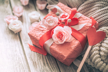 Beautiful red gift box on wooden background