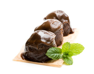 Sticky chocolate puddings isolated on white