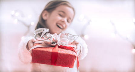 Christmas and Holiday concept little girl with a gift