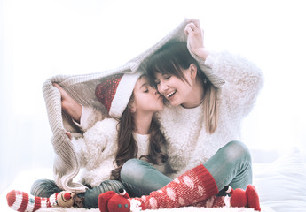 Christmas concept, mom and her daughter playing