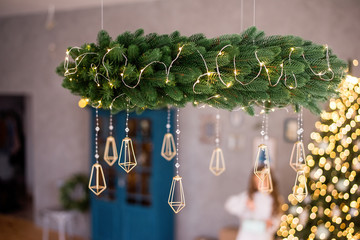 Beautiful Christmas chandelier of Christmas tree branches