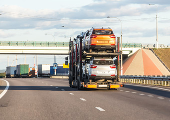 Car transporter carries cars along the highway