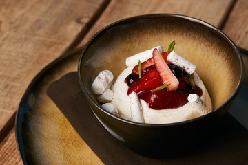 Estonian sweet dessert Kama with yoghurt mousse, wild berries an