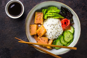 Hawaiian salmon poke bowl with seaweed and avocado