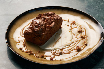 Plate with dessert , chocolate fondant lava cake with custard