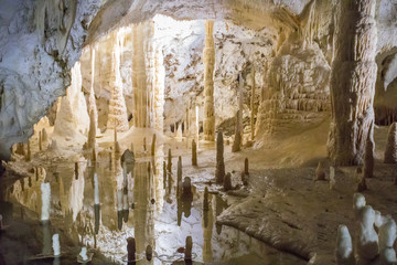 Stalactite and Stalagmite Formations into the Cave