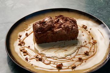 Plate with dessert , chocolate fondant lava cake with custard