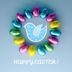 Easter greeting card with traditional colorful chocolate easter eggs