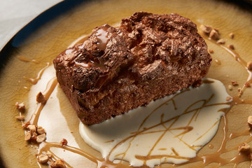 Plate with dessert , chocolate fondant lava cake with custard