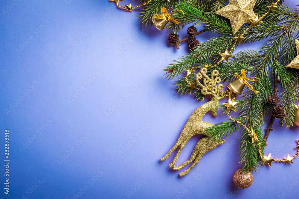 Wall mural blue christmas and new year background with decorated fir tree and toys. space