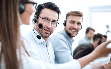 call center staff discussing something in the workplace