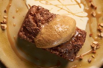 Delicious chocolate fondant lava cake with custard and pistachio