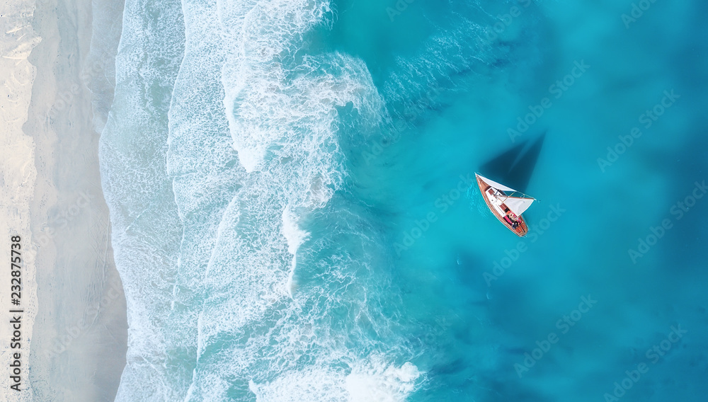 Wall mural yacht on the water surface from top view. turquoise water background from top view. summer seascape 