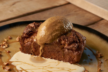 Delicious chocolate fondant lava cake with custard and pistachio