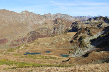 Panorama with yellow autumn hills, lakes and mountains. Abkhazia.