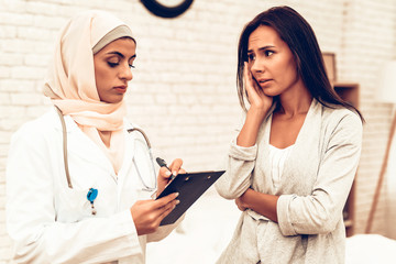 Arabic Pediatrician Appointment Mom with Sick Son
