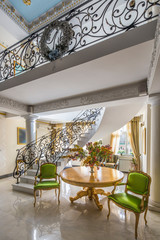 luxury lobby interior. Staircase with handmade wrought Iron Railing