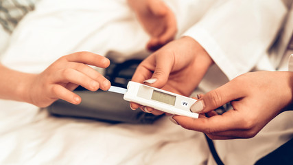 Close up of Measuring Blood Sugar Level to Child