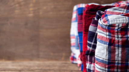 shirts plaid on wooden background