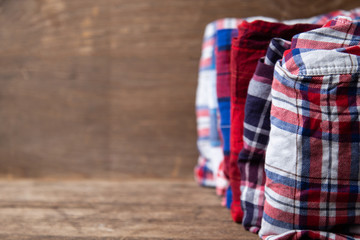 shirts plaid on wooden background